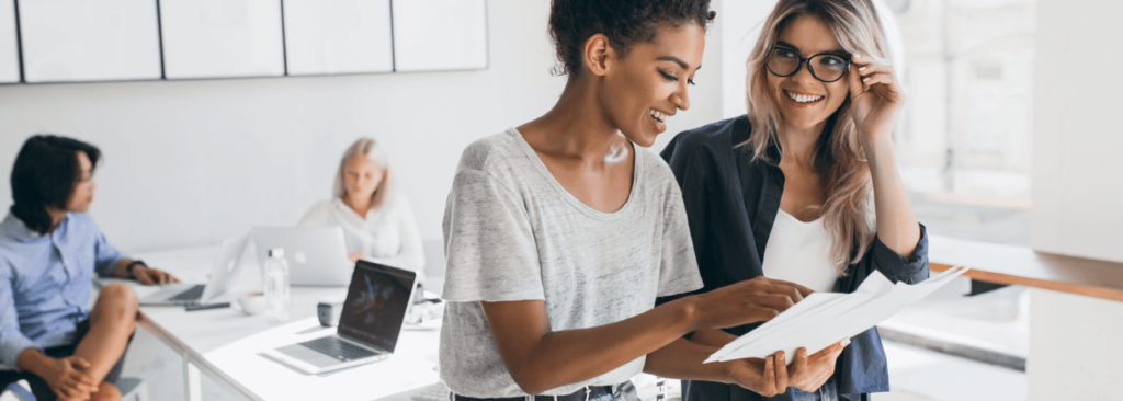 Young woman holding business plan.